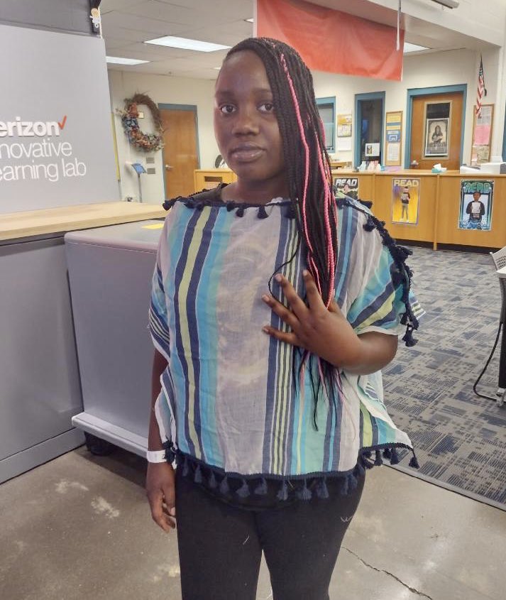Check out the latest FASHION apparel designed by Newburg‘s Sewing Club, “Soul To Sew.” Eighth grader, Faustine, PROUDLY models her BEAUTIFUL blouse! #TheArtOfSewing