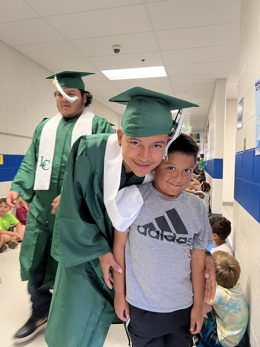 SherriCamp11's tweet photo. Graduation Walk at LCES. A few of my EL babies with their siblings. @DCSELDepartment @TweetDCS_LCES https://t.co/gxW7KpUALa