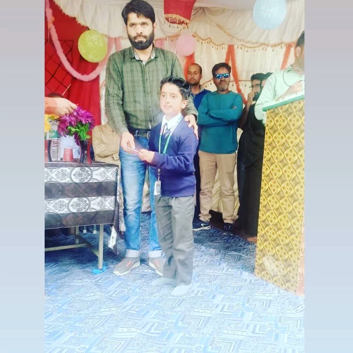 Ags_Ziran's tweet photo. #Mifat of class 9th recieving #first_prize (during Naat and Seerat competition) at Hazrat Baba Reshi R.A Central High School Hajibal Tangmarg. https://t.co/Tsn97WKXsn