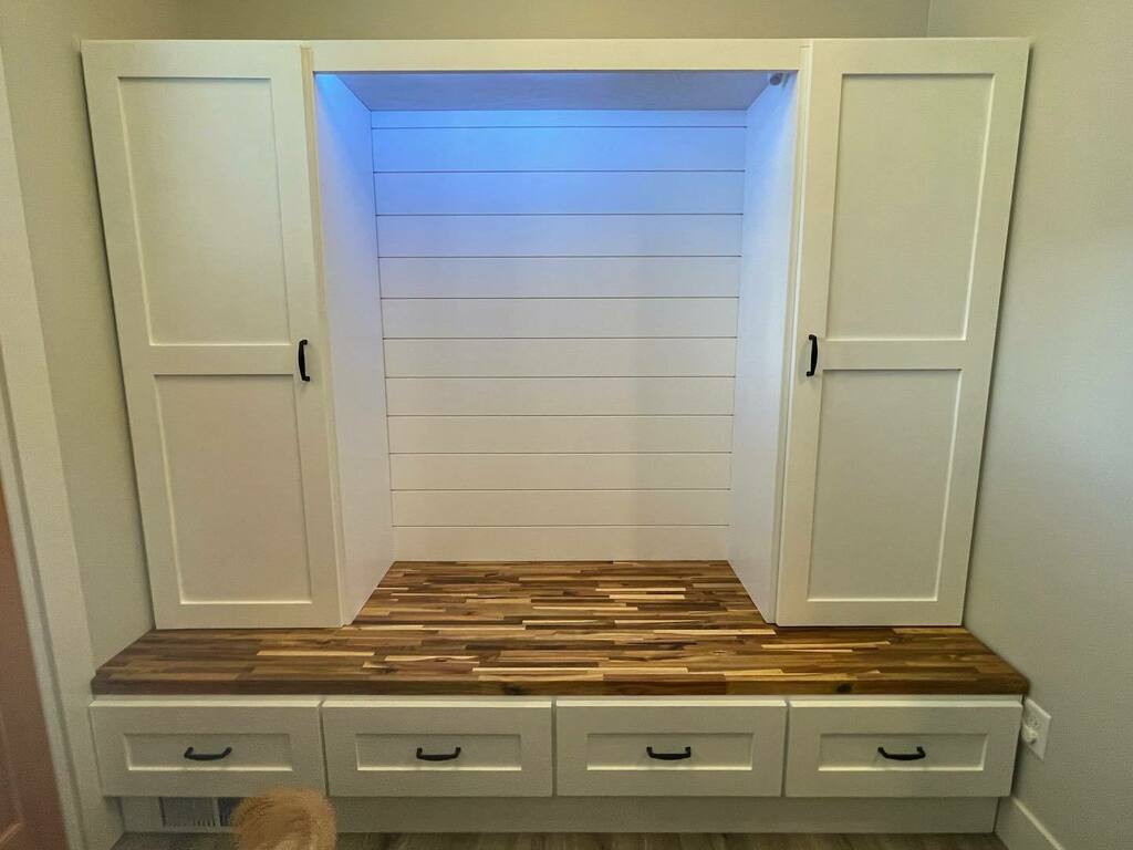 Phase two of the entry storage bench is done. Shiplap, Mid cabinets with angled shoe shelves plus motion activated LEDs. Next project is the upper cabinets. Bonus = puppies! instagr.am/p/CdxEqacLpXT/