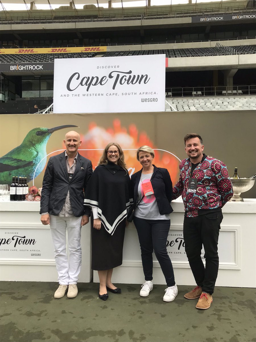 Wesgro's tweet photo. Western Cape Minister of Finance &amp; Economic Opportunities, @MireilleWenger, Wesgro's Chief Destination Marketing Officer, @MonikaIuel with reps from This Is Beyond Group doing a walkabout at the #WeAreAfrica tradeshow @CapeTownStadium to engage with travel brands and buyers. https://t.co/7mN3VnfgnE