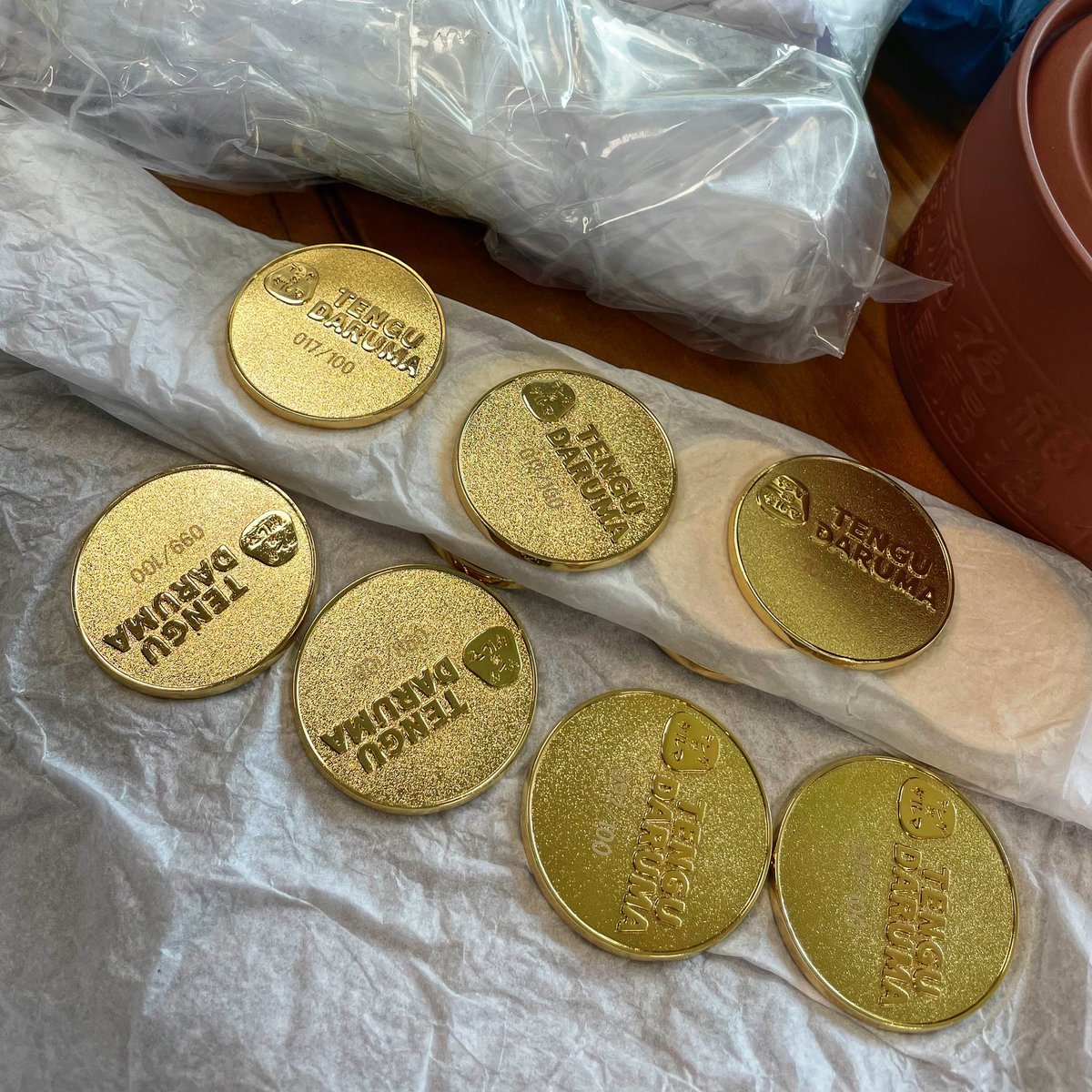 UnDeR20_Studio's tweet photo. This is the metal numbered plaque on the bottom of the TenGuDaruma artwork sculpture, which is limited to 100 bodies. The sculpture is now available for pre-order in the UnDeR20 WeChat program and will probably ship in July. The sculpture is linked to our upcoming NFT project. https://t.co/CbwCBpygOj