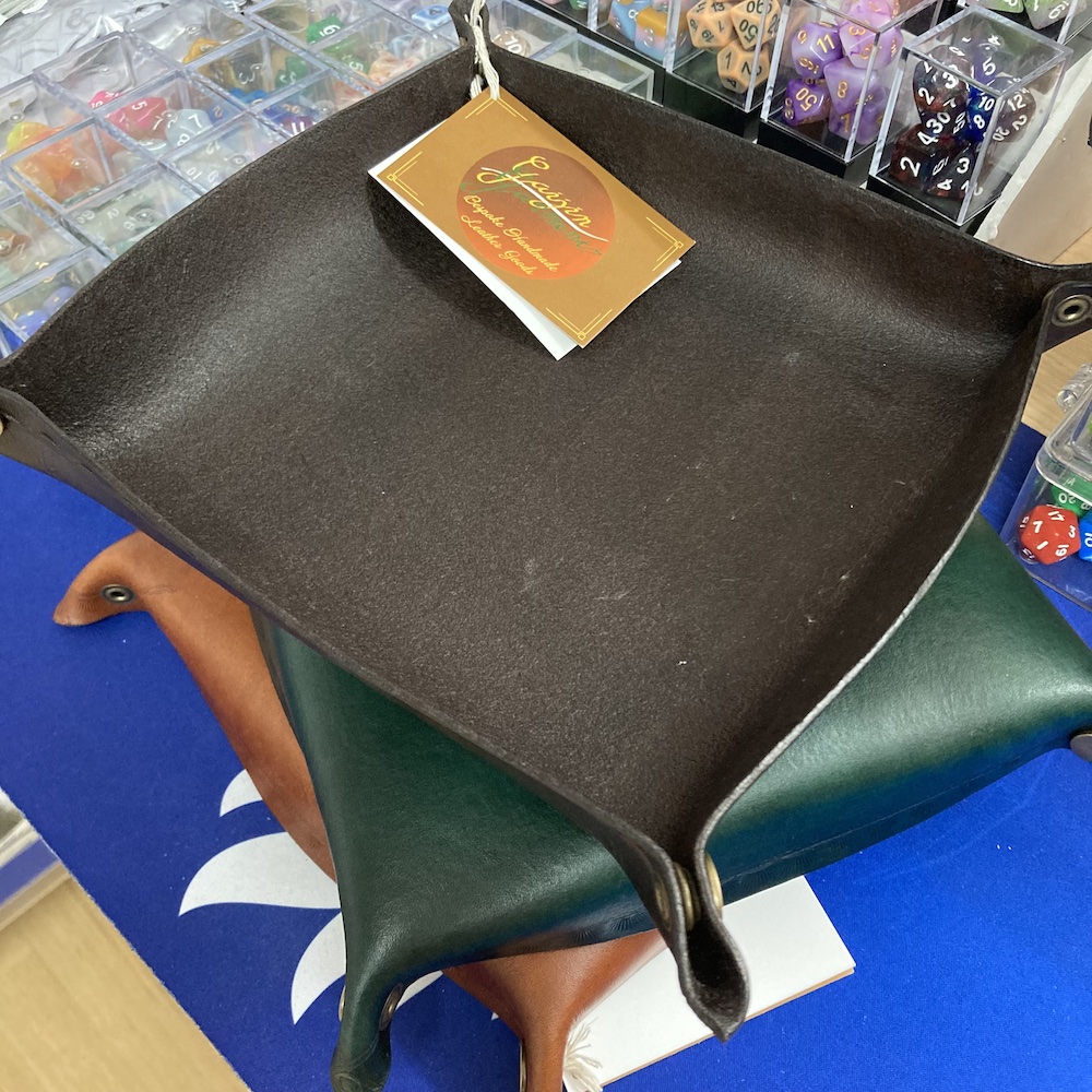 proudlioncomics's tweet photo. Need a new dice tray for your table? Want to support a local creator, and your local game store at the same time?
Then you should definitely check out the beautiful, handcrafted leather dice trays from Gaijin Gamer, available in store right now!
#localcreator #handcrafted https://t.co/lYAFxcXarB