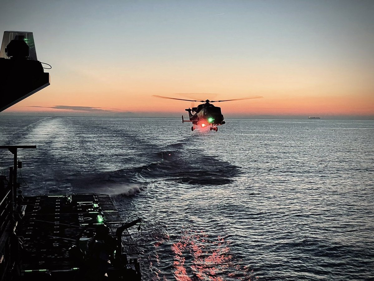 Wildcat off the flight deck of HMS Trent as the sun goes down