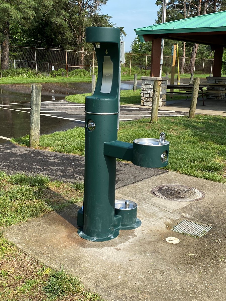 SycamoreTwp's tweet photo. This morning, members of the @SycamoreTwp maintenance crew installed a new water fountain at Bechtold Park near Shelter #3. Good news for people and pets alike! This little dog was already enjoying a drink on this hot day. #moreinsycamore https://t.co/9g6Ye5KVXd