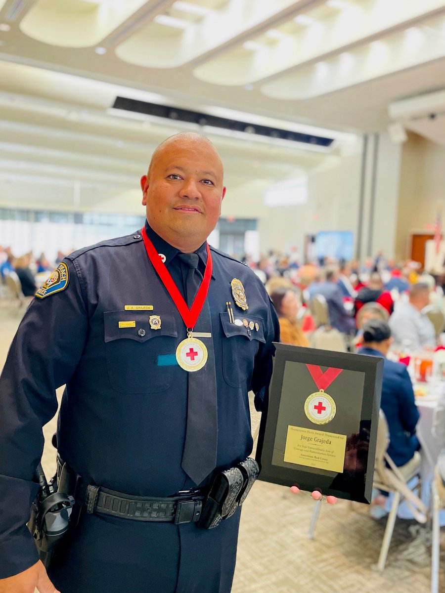 LBPD's tweet photo. Yesterday, #LBPD Officer Grajeda was presented with a “Hometown Hero Award for Extraordinary Acts of Courage and Humanitarian Service” from the American Red Cross. Earlier this year, while off-duty, he noticed a nearby residence on fire.🧵⬇️ https://t.co/4mdKRtbQbu