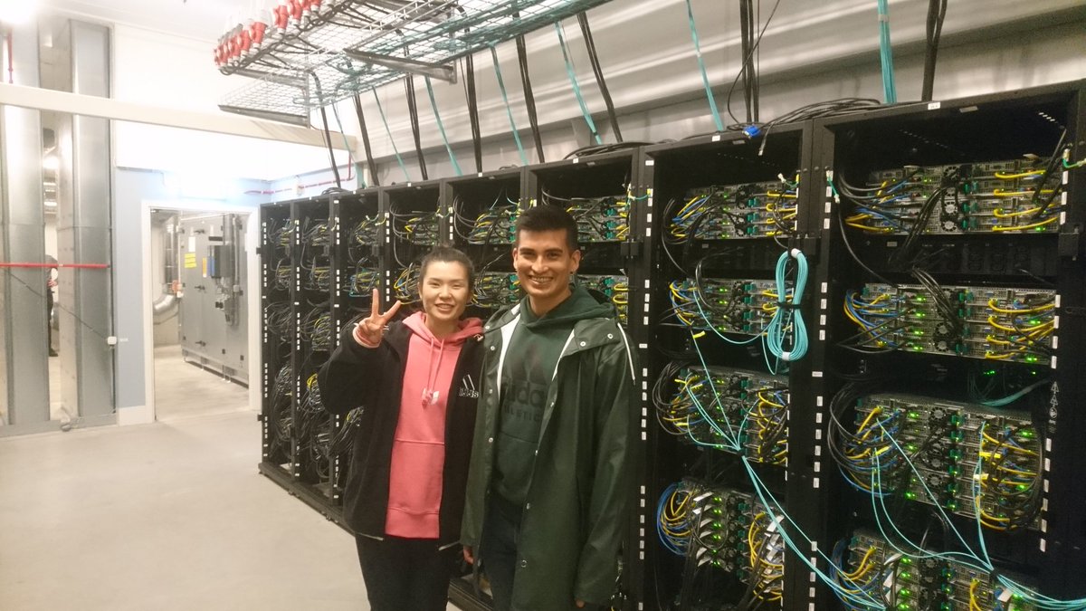 Our team members <a href="/Ying_Li924/">Ying Li</a> and <a href="/ferradest/">Seba Ferrada</a> inside the Tetralith cluster, NSC's flagship system with 60,544 compute cores.
