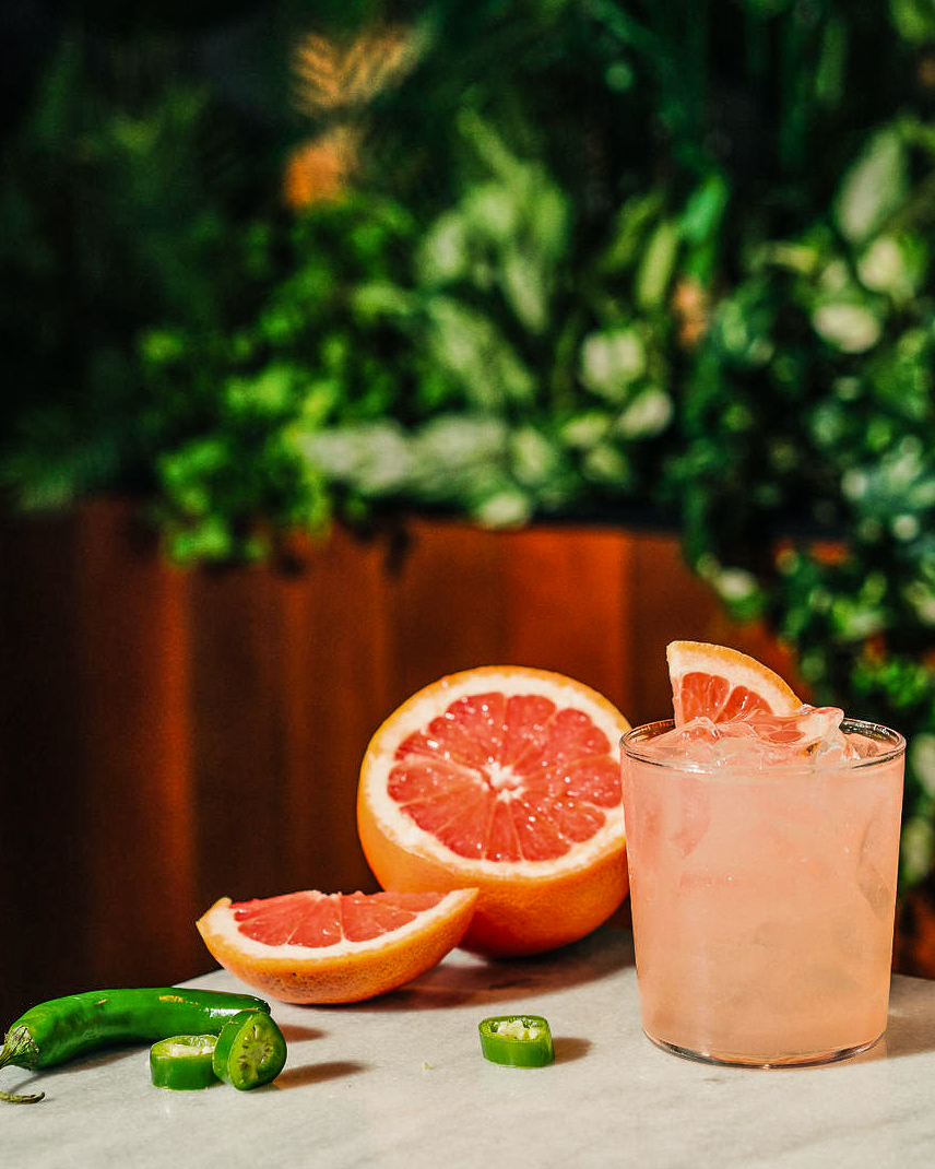 Looking for a drink to spice up the long weekend? Our Smoky Paloma might just be the one. Smoky mezcal meets refreshing grapefruit juice with a hint of Serrano pepper heat. Start your long weekend right and try one tonight. #JOEYRestaurants #paloma #mezcal #cocktails