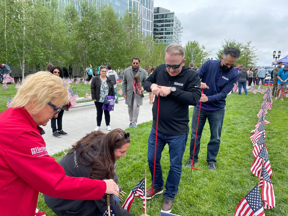 HanscomFCU's tweet photo. Tomorrow is the start of #PatriotWeek, which runs from 5/21-5/31 and honors fallen service members and reinforces the true meaning of Memorial Day. This morning, HanscomFCU employee volunteers spent a few hours placing flags at the @MAFallenHeroes memorial in Seaport Common. https://t.co/irCKTADbwg