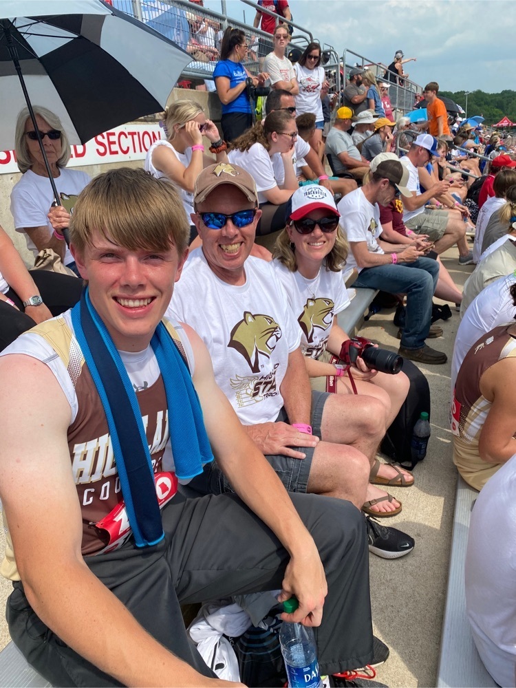 Drew Mallett pictured with his parents after breaking the school record in the 200m dash with a 21.84.