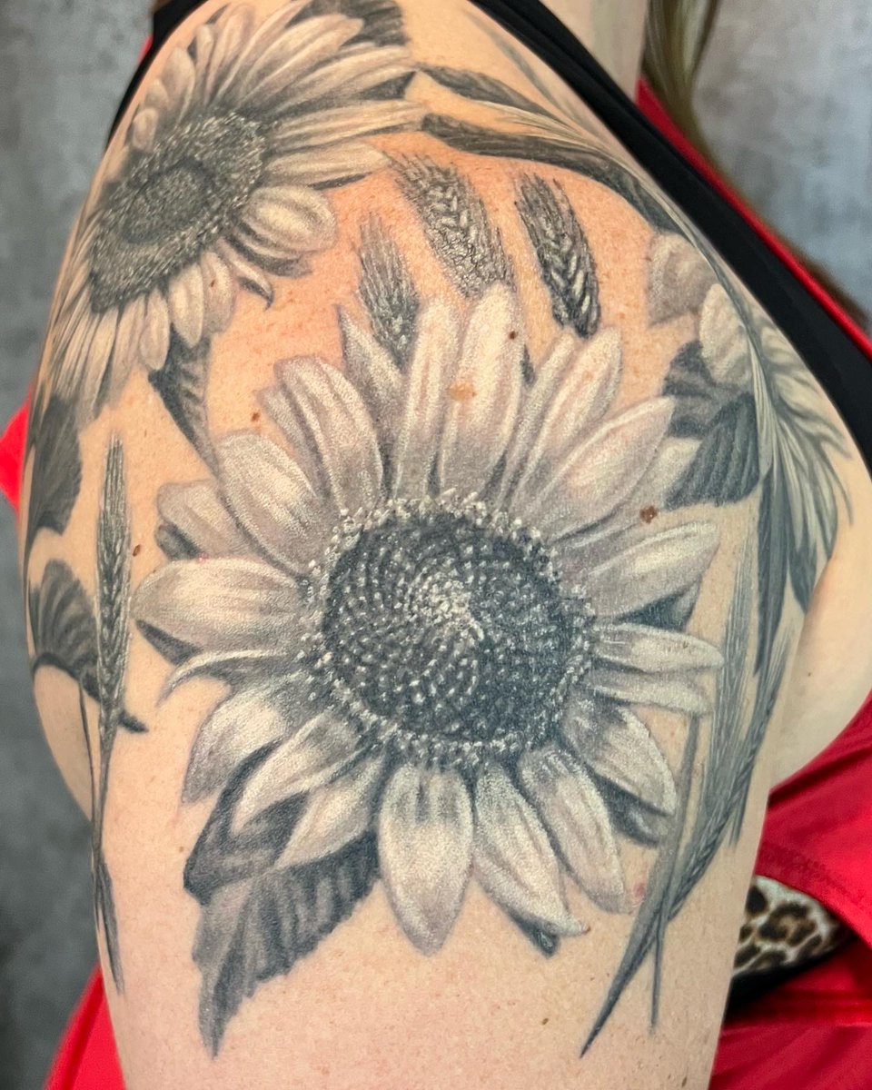 NuclearInk's tweet photo. We love tattooing the friends and relatives of our clients. These fun Sunflowers are on the shoulder of a client whose husband is getting a full backpiece from Jesse, her cousin already has one and cousin’s spouse has an awesome 1/2 sleeve. #sunflower #sunflowertattoo #tattoo https://t.co/Ds3wbsBr17