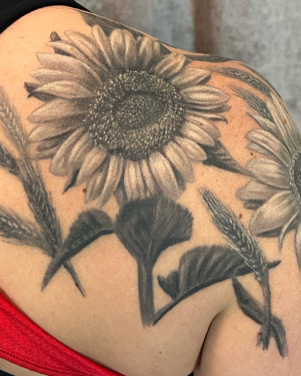 NuclearInk's tweet photo. We love tattooing the friends and relatives of our clients. These fun Sunflowers are on the shoulder of a client whose husband is getting a full backpiece from Jesse, her cousin already has one and cousin’s spouse has an awesome 1/2 sleeve. #sunflower #sunflowertattoo #tattoo https://t.co/Ds3wbsBr17