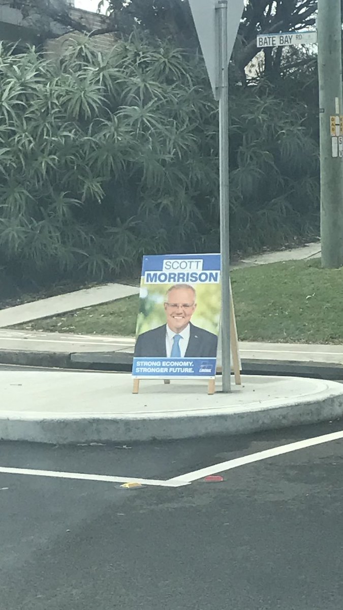 Wandapioneer's tweet photo. Scott Morrison corflute illegally placed on island outside polling place, Cronulla High School today.#votelibsout #hometoBilo #alboforPM https://t.co/IIZVBuZG8M