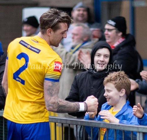 pfbphotography's tweet photo. @IsthmianLeague @PitchingIn_ @cheshuntfcscore @CheshuntUltras @AmyEve93 @NonLeagueCrowd @nonleagueshow @NonLeaguePaper @MrNonLeague @townsendaround Harrison Parker brings joy to a young fan after Lancing beat East Grinstead at Culver Road last season. https://t.co/829UwwaSnS