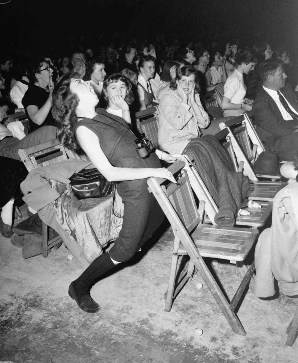 historydefined's tweet photo. Teenagers at an Elvis Presley concert, Philadelphia Arena, 1957. https://t.co/TPyNRwLEKV