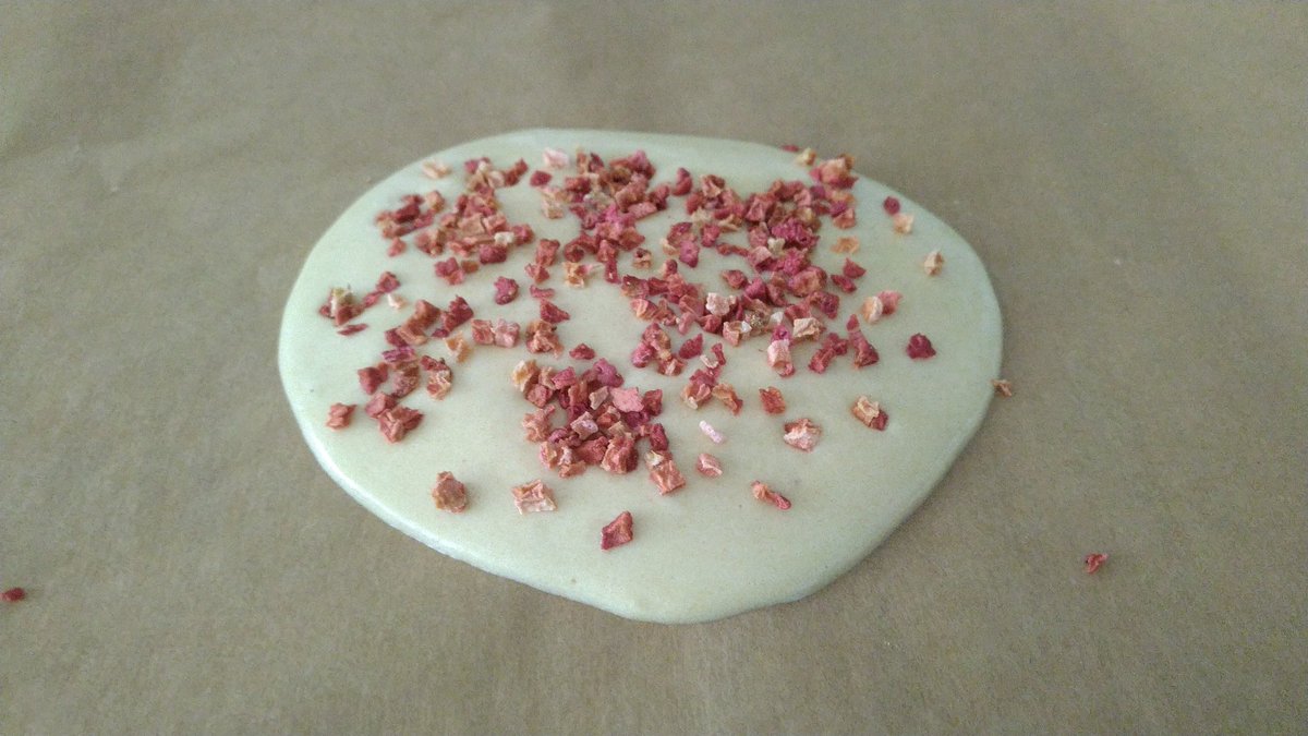 First try of white chocolate with brown cassonade sugar. And freeze-dried strawberry on top.