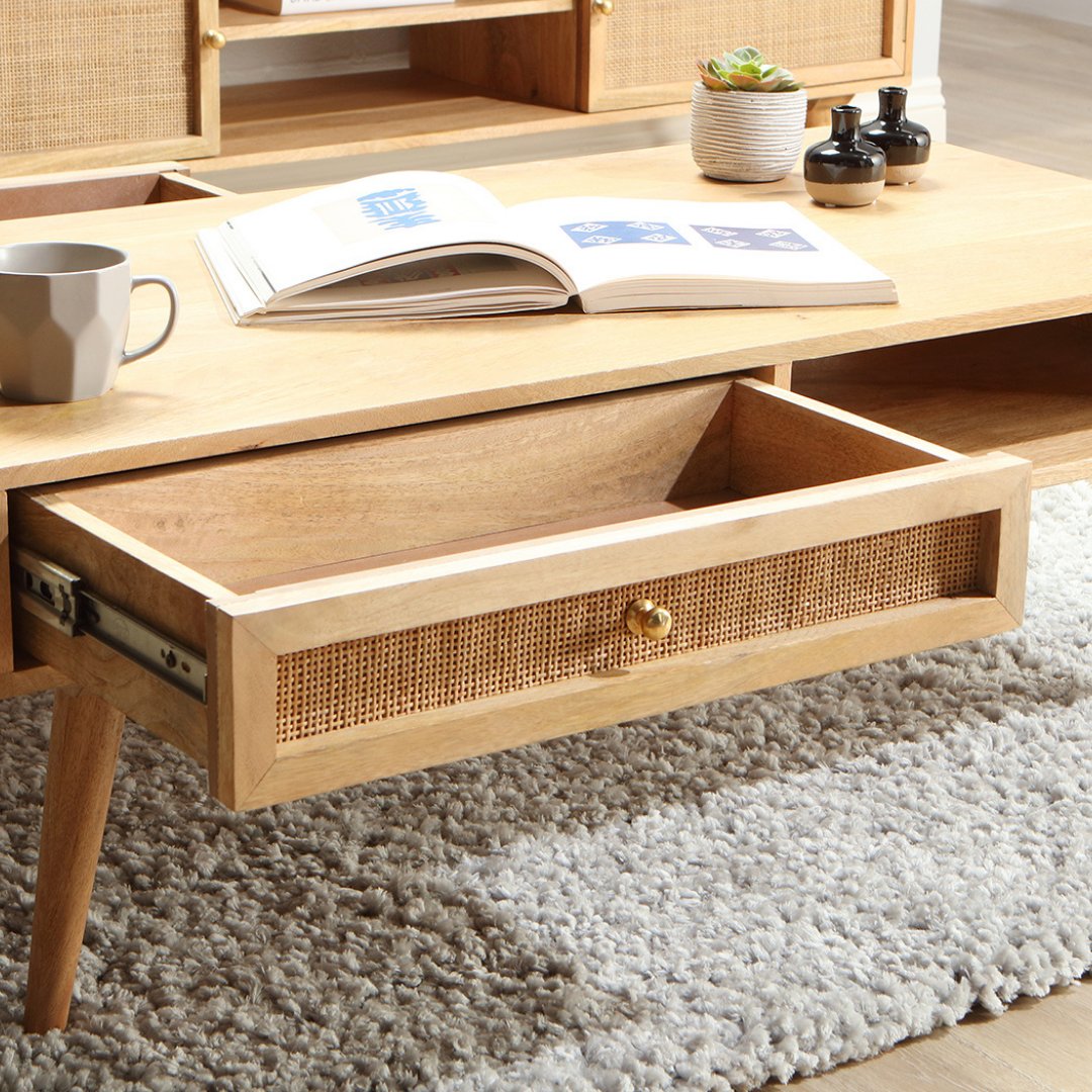 Handmade from solid mango wood and natural rattan, the Manhattan coffee table has two drawers and an open shelf for extra storage. bit.ly/38UJQ8b

#furniture #wickerfurniture