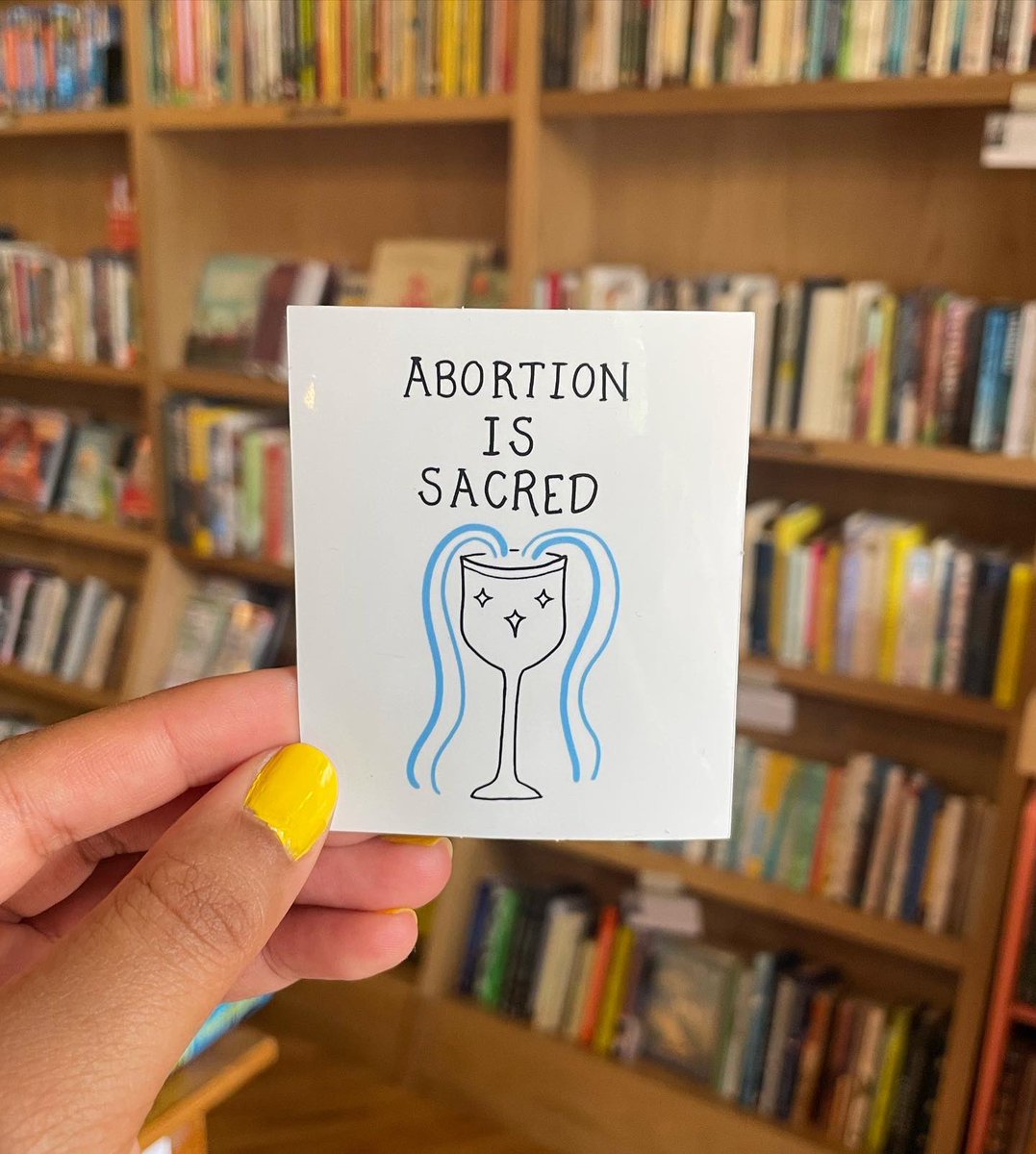 lesbiandotgov's tweet image. abortion is sacred stickers are here! available for $3 at the raven, soon at wonder fair, and you can also dm me if that’s easiest!