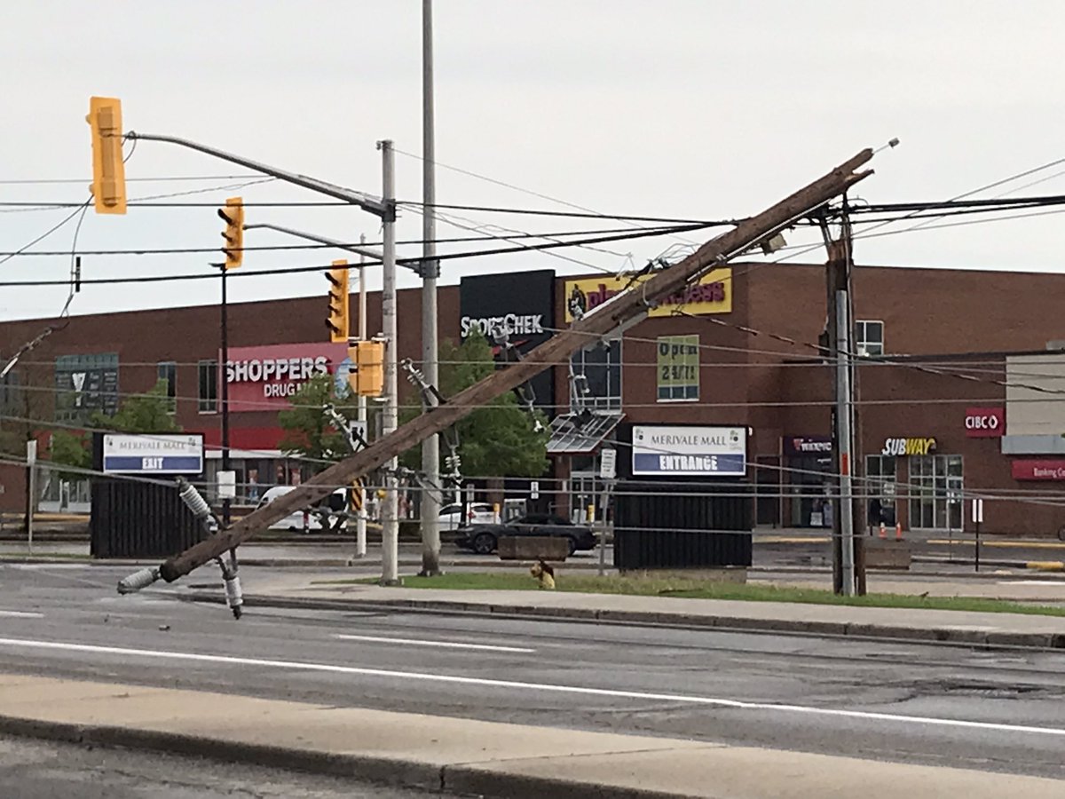 KatherineDines's tweet photo. Counted at least 6 hydro poles snapped along Merivale Road in front of mall. Lots of fire crew on scene. @OttFire #Ottawa #Storm https://t.co/znarQ9TZGL