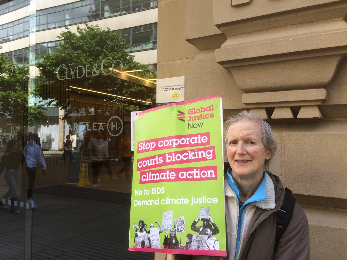 stpennells's tweet photo. Phoebe of Stockport Quakers making a quiet point outside .@ClydeCoNews offices in S. Ann's Sq. #Manchester- 3rd. biggest globally! Raising signatures for #StopISDS & #ExitISDS https://t.co/P36RgpX7tj