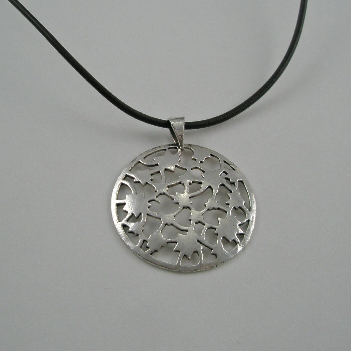stoneberri's tweet photo. Brown Leather Necklace with a Sterling Silver Round Cut Out Pendant https://t.co/kYJOdZWerN #Stoneberri #Etsy #18Inches https://t.co/aU2Dsx0cVJ