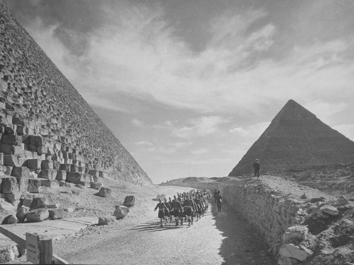 historydefined's tweet photo. British troops march past the Great Pyramids in Egypt, 1940. https://t.co/Ju0IFf0tcb