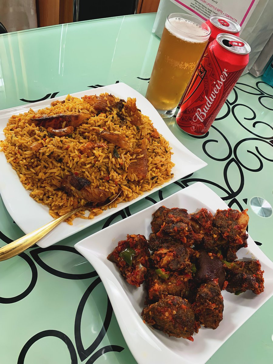 Today’s menu: Native jollof rice (palmoil rice) & peppered goat meat & the King of beers. 🍲🍖🍺😊