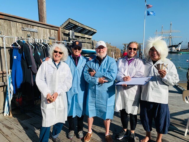 DolphinClubSF's tweet photo. Thanks to our swim timers, looking spiffy and scientific in their lab coats! #swimforscience https://t.co/v00Qh7nyYx