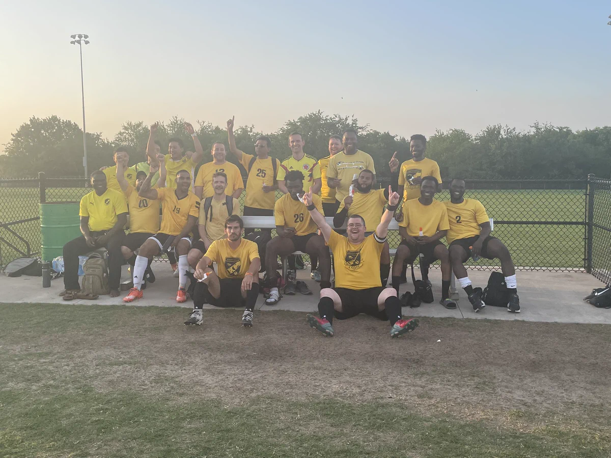 @drcegme and other members of the ambassador soccer team posing for a team picture