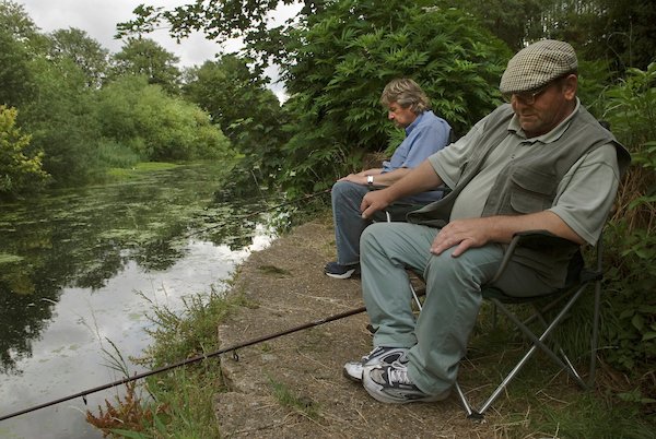 BEFORE THE BLUE WALL. Fishermen the Old River Lea, Hackney Marsh July 2006. fistfulofbooks.com/product/before… prior to the building of the 2012 London Olympic Park, and regeneration of the Lower Lea Valley, Stratford east London. Published by Fistful of Books. #photographers #photobook