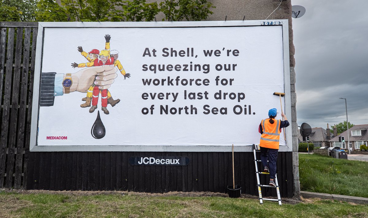 BrandalismUK's tweet photo. [1] "We're squeezing our workforce for every last drop of North Sea Oil."   

Ahead of the @Shell AGM, we installed these billboards across Aberdeeen, the oil capital of Europe, in solidarity with rig workers demanding better pay + conditions. 

#JustTransition https://t.co/Q82CpNjxCh