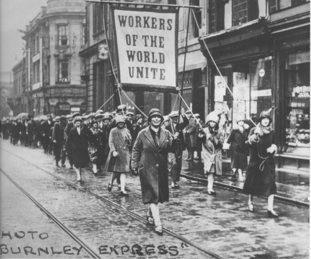 HLLancashire's tweet photo. #OTD in 1928 in Nelson, J Husband, a weaver and representative of the Weaver's Assoc. was dismissed for bad work. A 7 week strike involving 15k weavers ensued, until an agreement was reached. This fantastic image is from the #RedRoseCollection https://t.co/BkFKNzvdSs