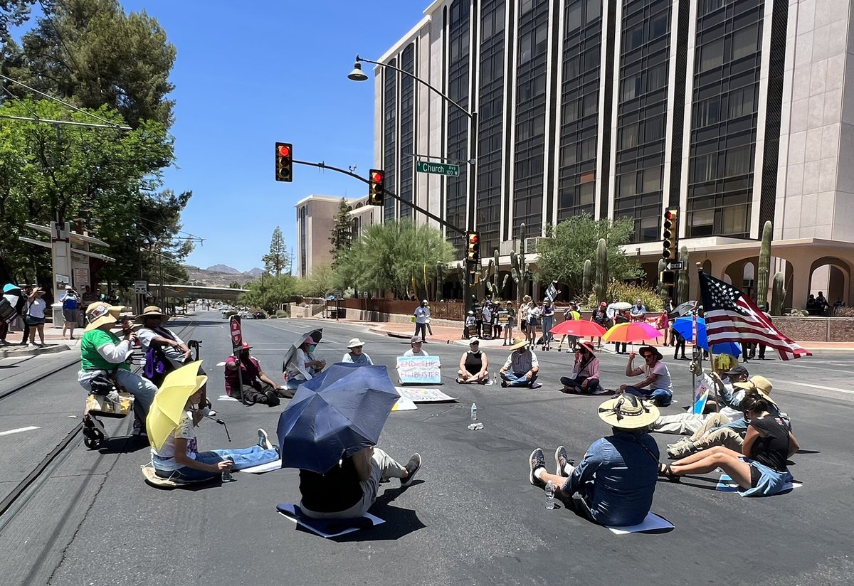 caseyclowesaz's tweet photo. UU Ministers Rev. Bethany Russell-Lowe and Rev. Matthew Funke Crary have joined activists in risking arrest to call on @SenatorSinema to #EndTheFilibuster to protect our people, planet, and democracy. #SitInToSaveAmerica #UUJAZ https://t.co/KO24JG5ct4