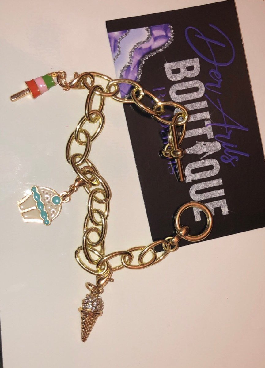 GlossetteCo's tweet photo. Excited to share this item from my #etsy shop: Sweet Treats #smallbusiness #blackownedbusiness #treats #sweet #charmbracelet #derarilsboutique #jewelry #handmade https://t.co/q1vbemInI3 https://t.co/VYZfgSkdmJ