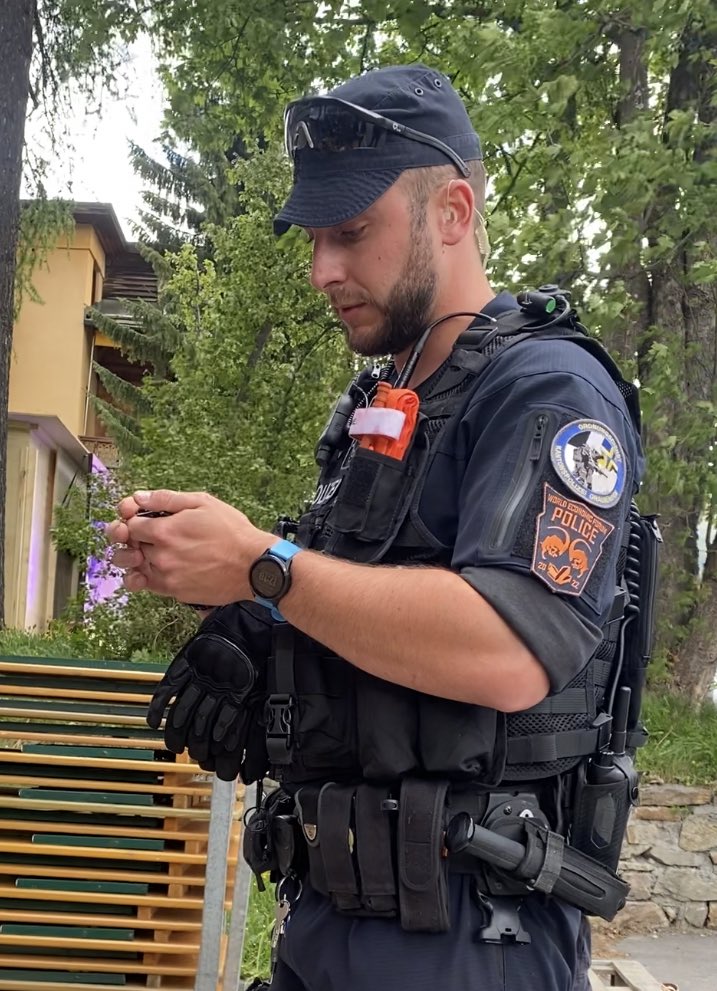 JackPosobiec's tweet photo. @bennyjohnson WEF Police badges https://t.co/Kn31CVWAjz