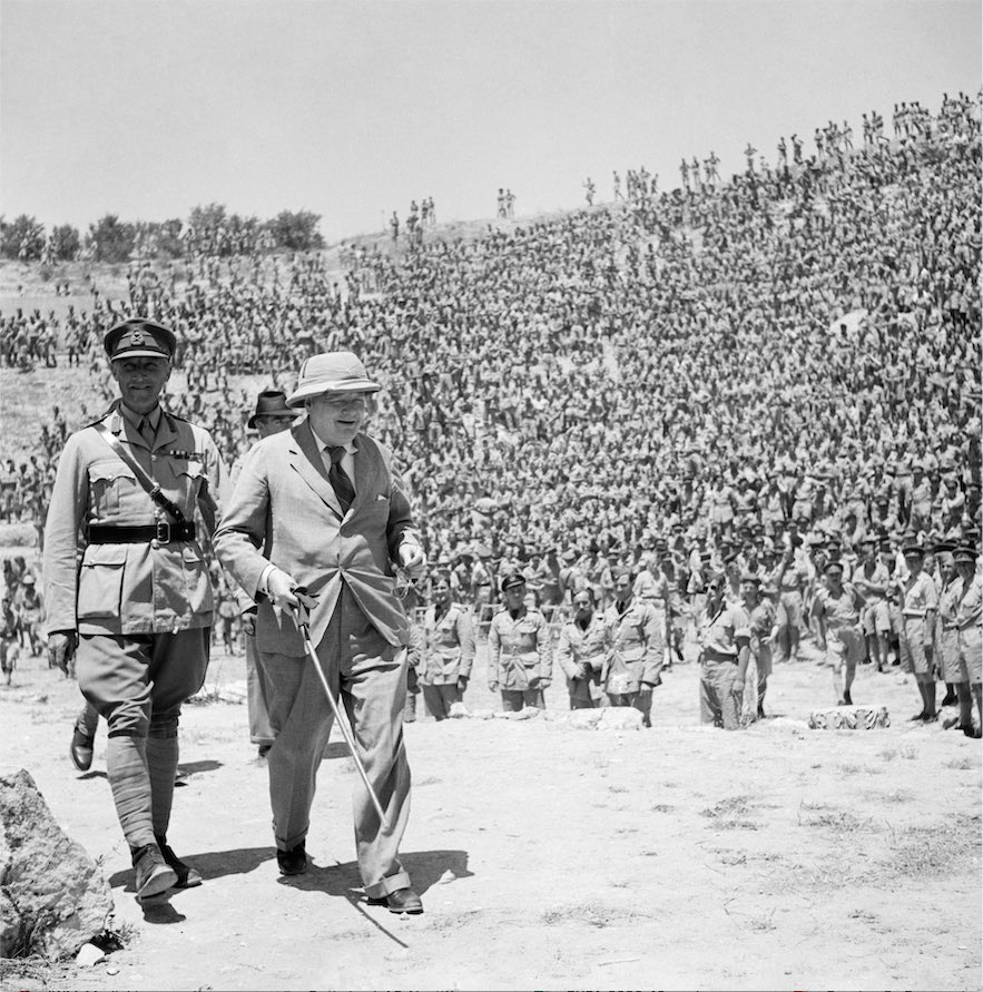 gevemac's tweet photo. Churchill visiting the troops in 1943, troops arrayed across the ruins of the Roman theatre at #carthage #archaeologicalstories #colonialisms #tunisia #WWII https://t.co/OXQyteizl8