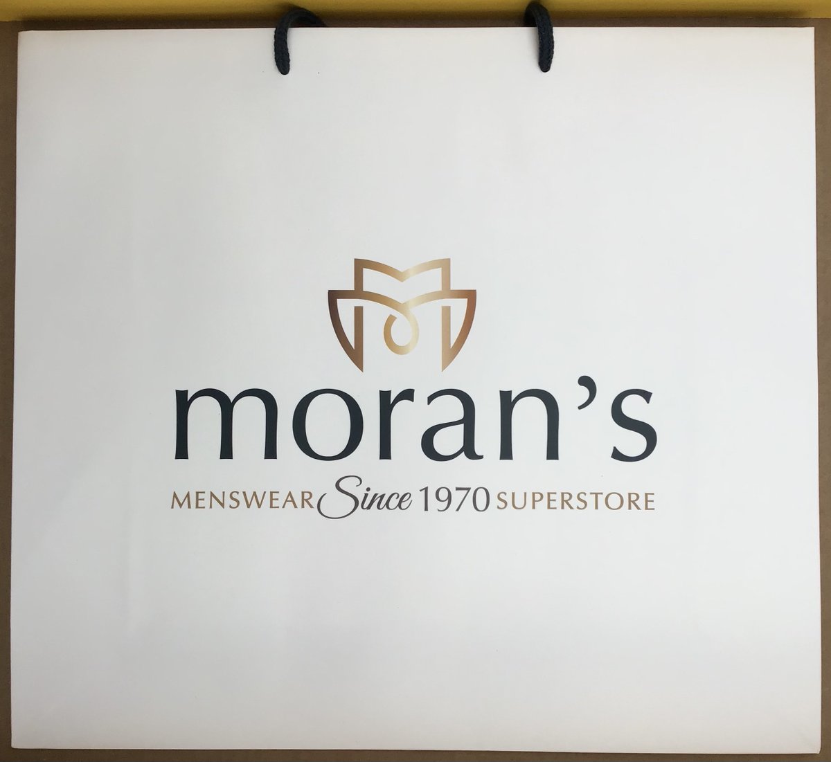 OldThurles's tweet photo. The evolution of the Moran’s Menswear bag, Friar St., Thurles, from plastic to paper. Paper &amp; card so much better. 🕴️@Designedly_ @ThurlesChamber @LegoLostAtSea @TippStudies https://t.co/I0n2AMCc08