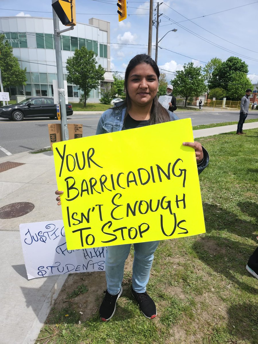 NSNPeel's tweet photo. Today, international students gave @slc_alpha @whatsinsideslc a clear message: you cannot play with our futures. If you do, no matter how many barricades you place, organized int’l students will break past them to expose your exploitative tactics. 

#JusticeforAlphaStudents https://t.co/h6jUiWkZjm