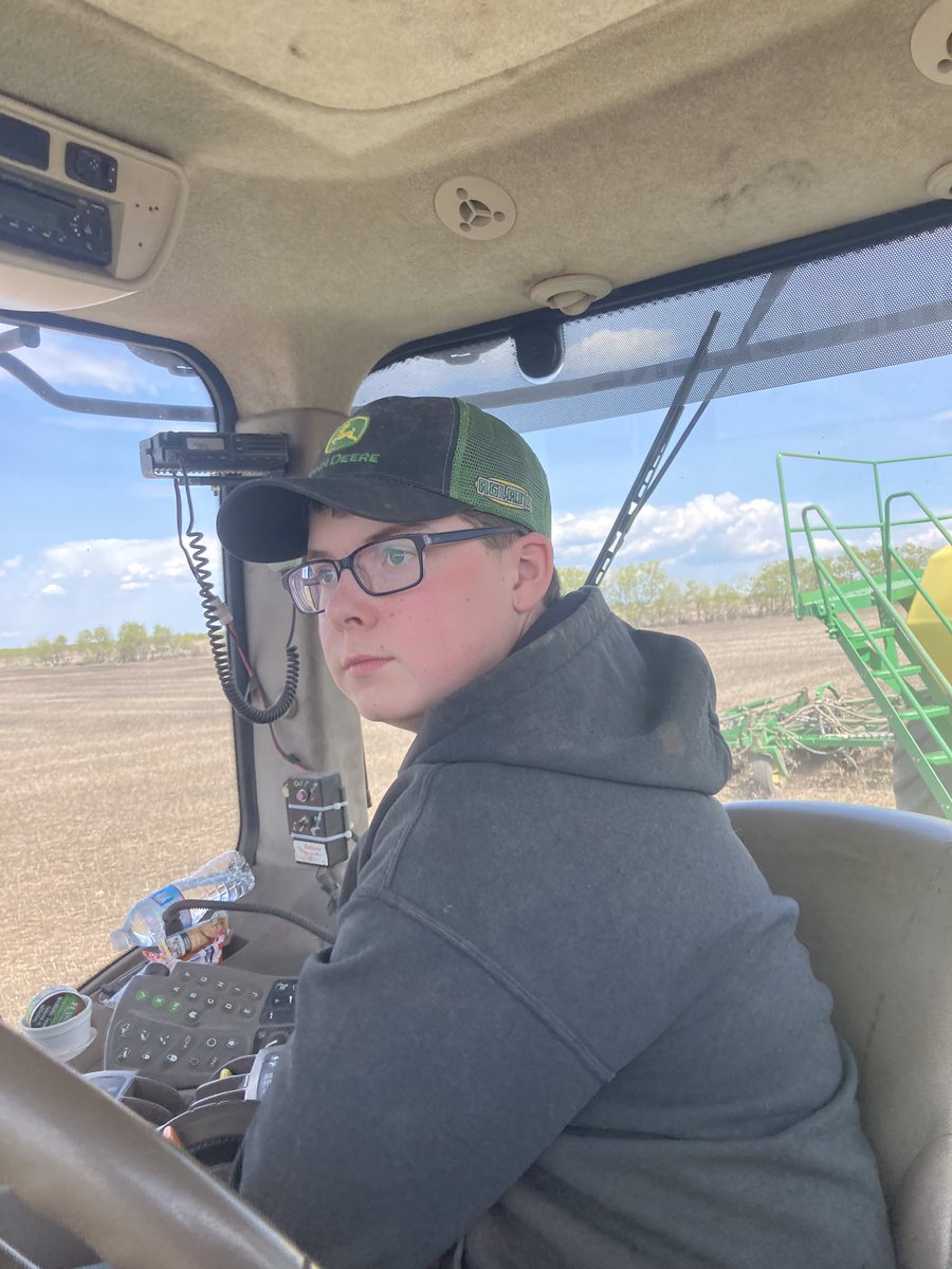 Conner spent the morning picking rocks. He doesn’t like that job, but knows his britches aren’t that big that he gets to get out of it. This afternoon he went seeding with his dad. Jay snapped the pic then came home. Conner’s on his own. #millardfarms