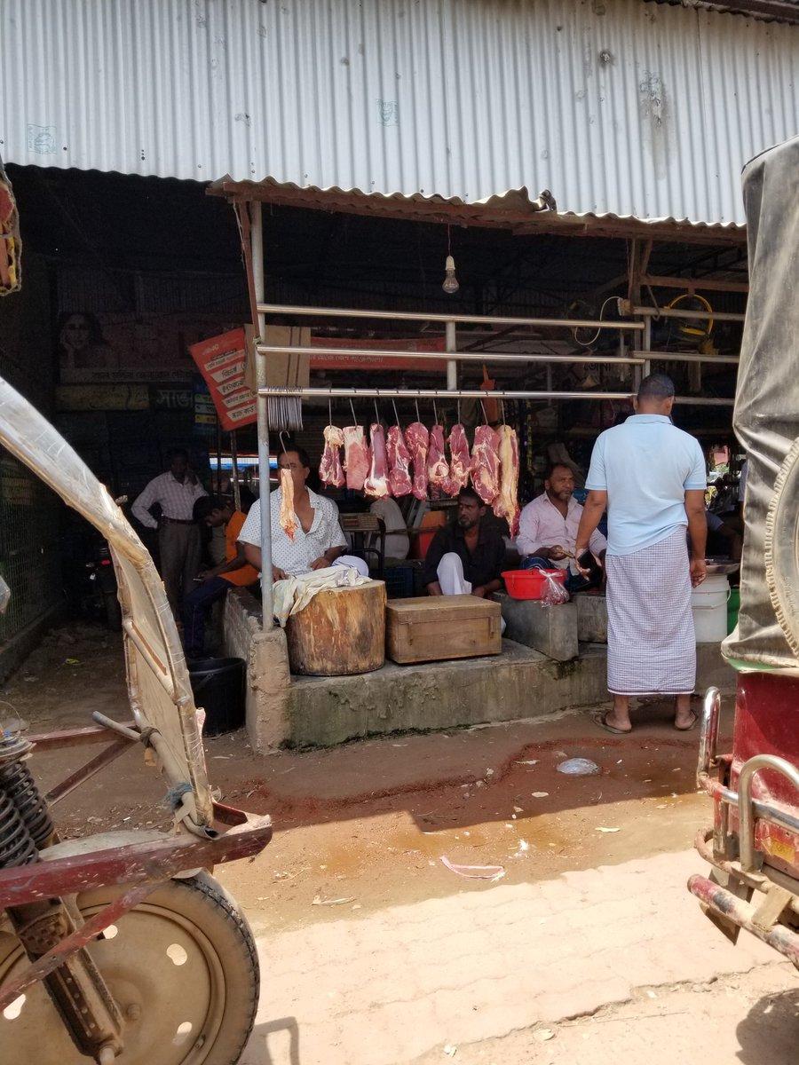 tclaycami's tweet photo. Just appreciate the way we purchase meat in the USA.  Meat stand in Dhaka, Bangladesh today. https://t.co/djj9qWvOVm