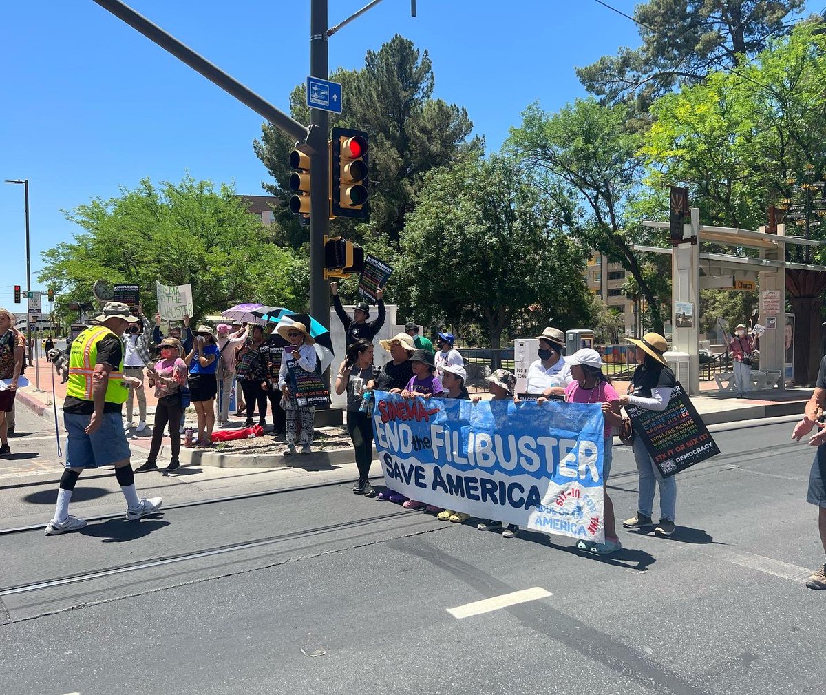 caseyclowesaz's tweet photo. Today I joined Arizonans to shut down traffic in Tucson to demand that Sen. Krysten Sinema end the filibuster for our people, planet, and democracy. #SitInToSaveAmerica #EndTheFilibuster https://t.co/7ZR7dnhoPk