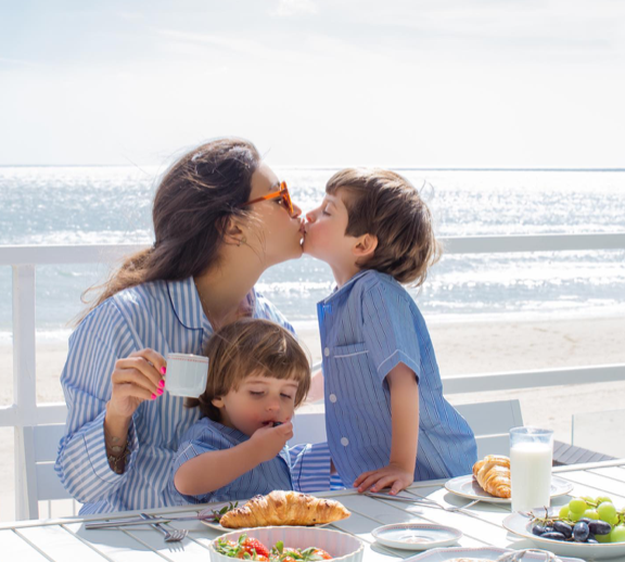 Breakfast by the beach with #mayawilliamz wearing our blue candy stripe pyjamas 🥐 ☕ #bonsoiroflondon #breakfast #beach #pyjamas