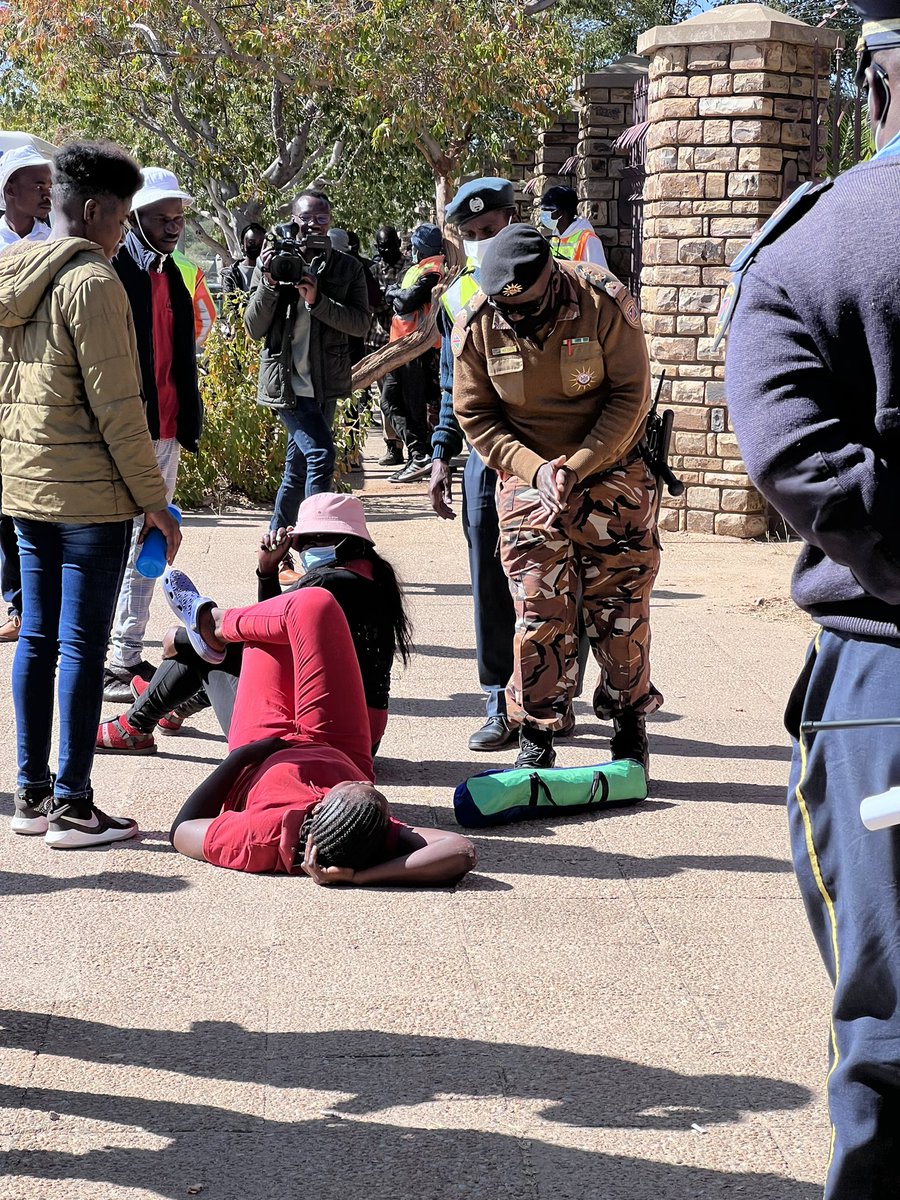 EagleFMNam's tweet photo. WE ARE CAMPING: 
Members of the public are lying down at the Katutura magistrate court entrance, saying they won't leave until Amushelelo and Nauyoma are granted bail.
Photos: Julia Heita 
#EagleFM https://t.co/PR6oqHKyRa
