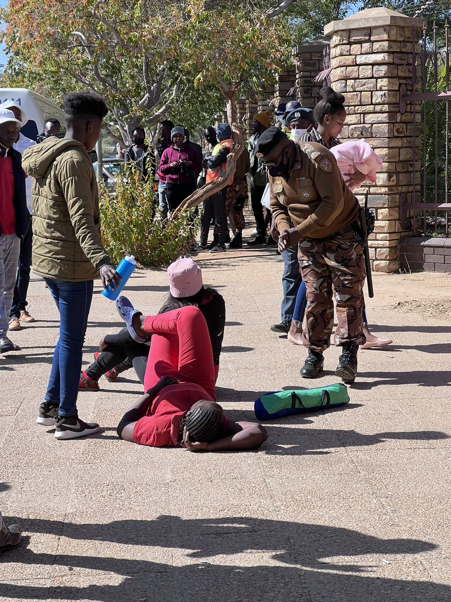 EagleFMNam's tweet photo. WE ARE CAMPING: 
Members of the public are lying down at the Katutura magistrate court entrance, saying they won't leave until Amushelelo and Nauyoma are granted bail.
Photos: Julia Heita 
#EagleFM https://t.co/PR6oqHKyRa