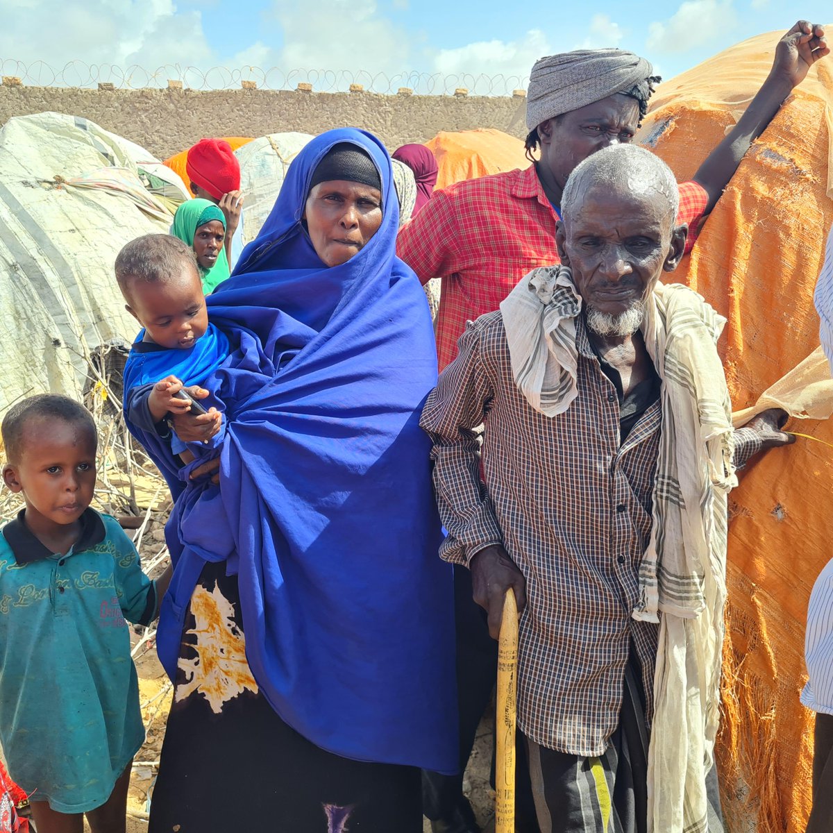 1/2 
90-yr old Mohamed Obare has never seen such a drought. He arrived with his family of 11 in Badbaado IDP camp in Nov. from El’ad, after losing 65 of 70 cows.

“I've been reduced to waiting for assistance &amp; handouts from neighbours, friends. It is the worst situation to be in”