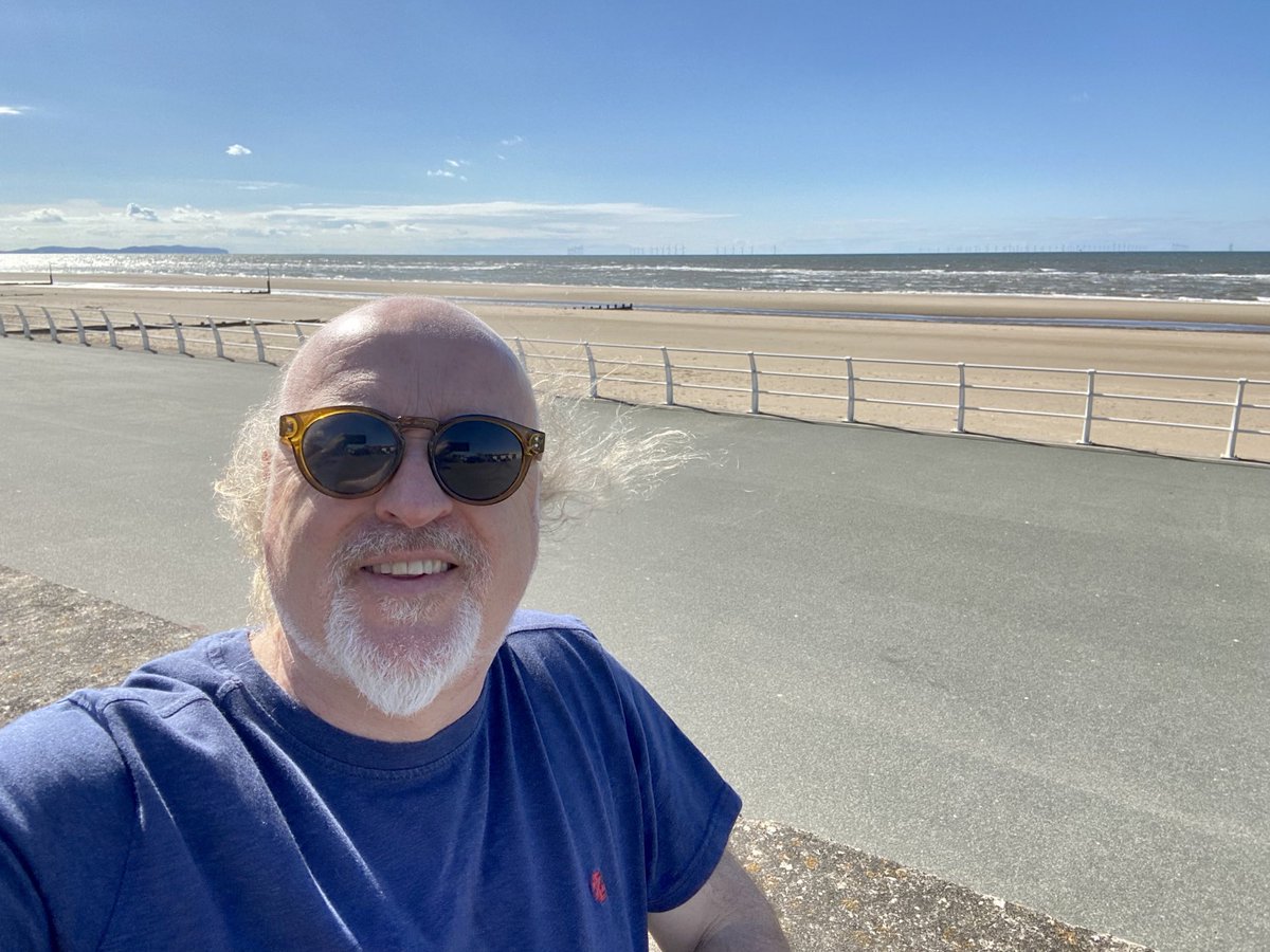A little windswept on the sunny seafront of Rhyl - ready to unleash the dogs of rock