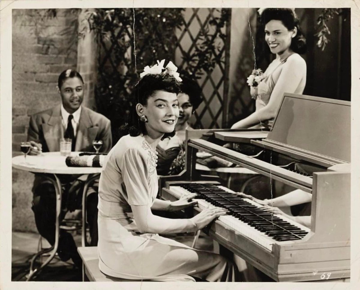 ALHCLindyHop's tweet photo. Una Mae Carlisle on the set of “I Like It ‘Cause I Love It,” a soundie from 1944

BTW have you starting planning YOUR Soundie for ALHC’s Soundies Film Fest? Ask a local band for a song and get creative. #unamaecarlisle #soundie #soundies  #film https://t.co/tWwc38laA4