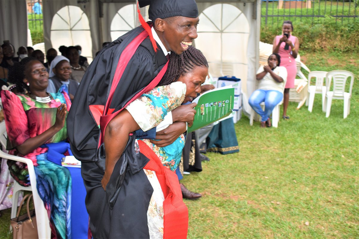 Mother to Ivan Wafula carries him on the back after he emerged third best at the school of Veterinary and Animal Resources with a BSc. of science in Veterinary Medicine @ProfNawangwe @Makerere @MakerereNews @WilliamBazeyo @JanetMuseveni @KagutaMuseveni #MakerereAt100