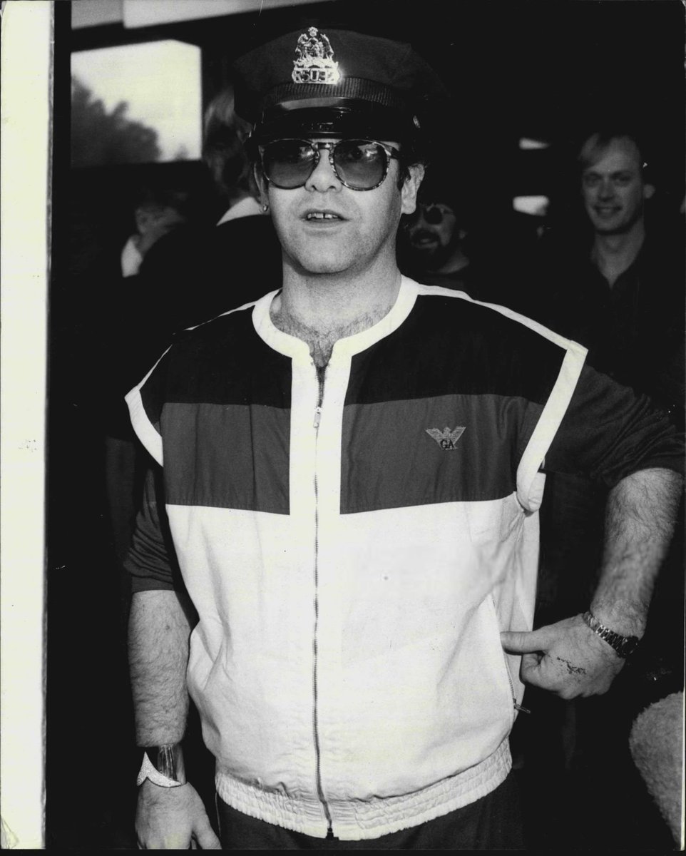 #EltonJohn arrives at Sydney Airport waving a New York policemens hat.

📷: Trevor James Robert Dallen