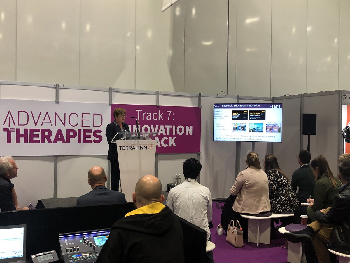 UCLTRO's tweet photo. Translational Research Group Head, Dr Pamela Tranter, provides an impressive overview of translation at UCL, outlining how we’re inviting others to join our Therapeutic #Innovation Networks (TINs). See us at stand 13 (see arrow, photo 2 below ⬇️) to get involved! #AdTherapies2022 https://t.co/bAQe0GDEXt